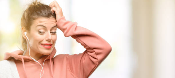 Young sport woman wearing workout sweatshirt doubt expression, confuse and wonder concept, uncertain future