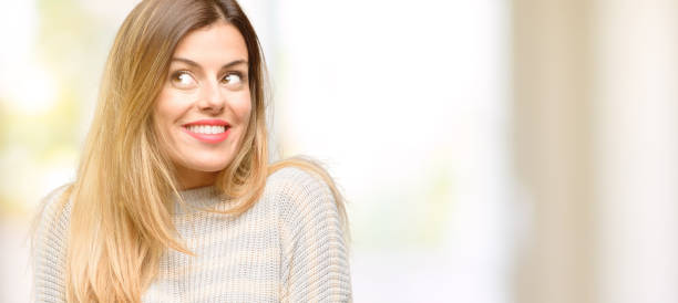 istock Young beautiful woman thinking and looking up expressing doubt and wonder 1049411212