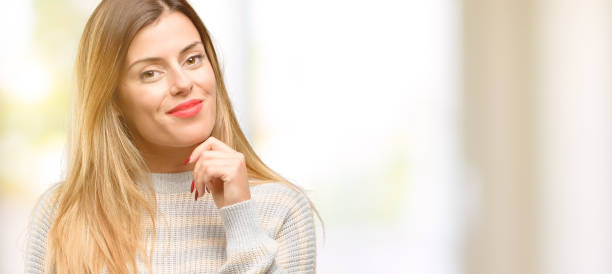 istock Young beautiful woman thinking and looking up expressing doubt and wonder 1049411270