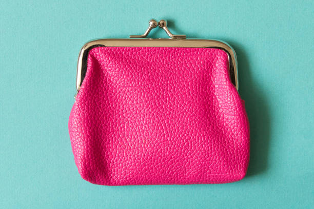 istock Pink wallet on turquoise background . Close up. Top view 1049412014