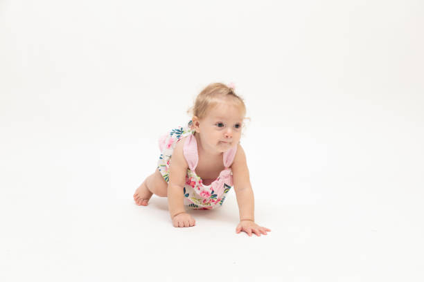 istock Happy baby boy is crawl on white background 1049412190