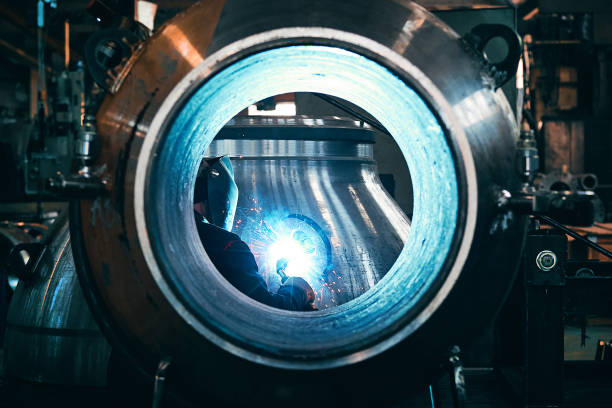An industrial worker with welding steel