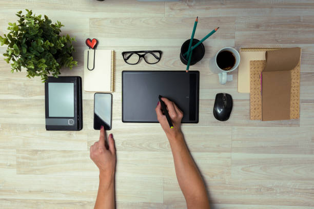 istock Hand of graphic designer working with stilus and tablet 1049412524