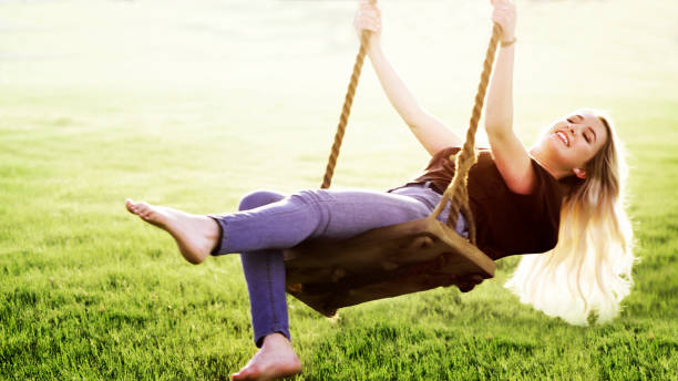 istock Young Woman Swinging 1049415946