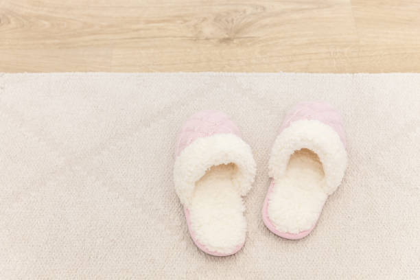 istock Pink cozy knitted slippers 1049425332