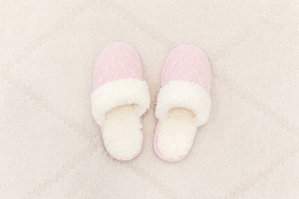istock Pink cozy knitted slippers 1049425414
