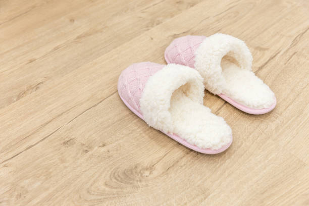 istock Pink cozy knitted slippers 1049425428