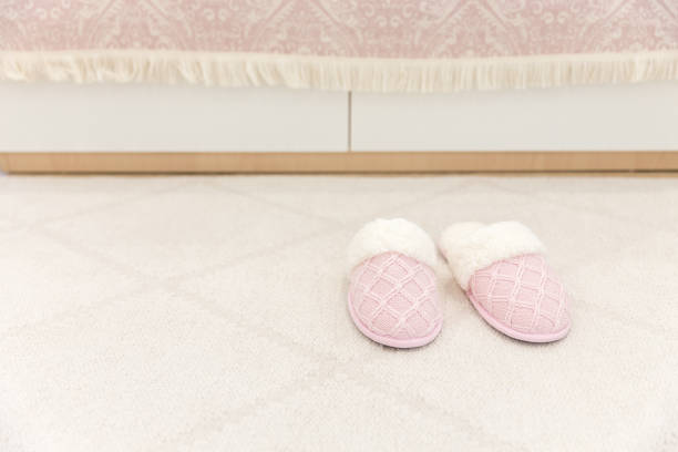 istock Pink cozy knitted slippers 1049425576