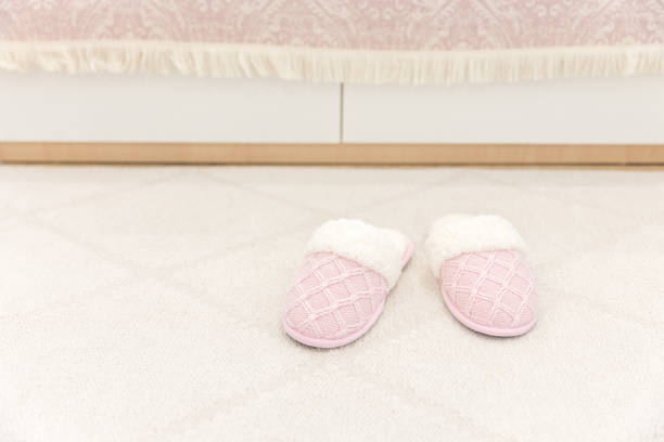 istock Pink cozy knitted slippers 1049425600