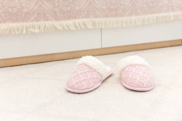 istock Pink cozy knitted slippers 1049425700