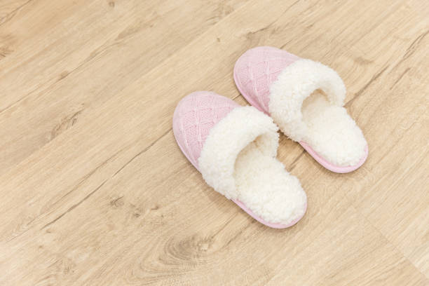 istock Pink cozy knitted slippers 1049425874