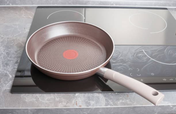 istock Frying pan on modern electric stove close up 1049425952