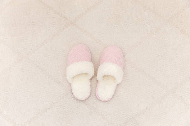 istock Pink cozy knitted slippers 1049425984