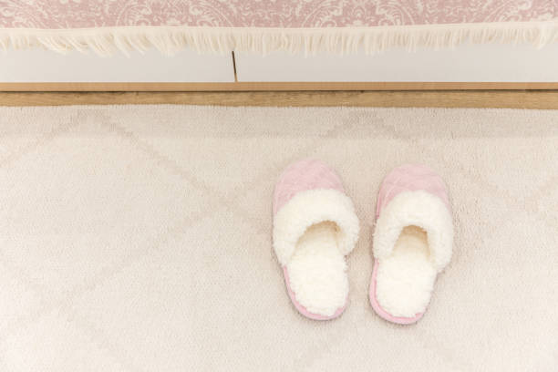 istock Pink cozy knitted slippers 1049426048