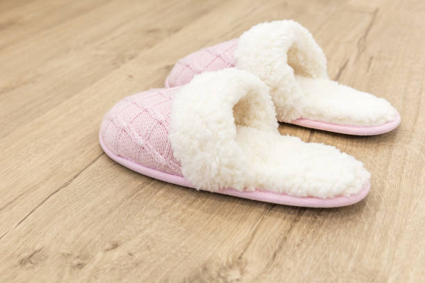 istock Pink cozy knitted slippers 1049426074
