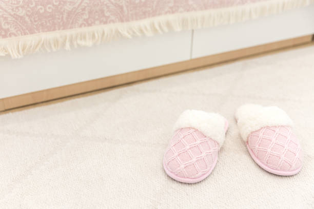 istock Pink cozy knitted slippers 1049426110