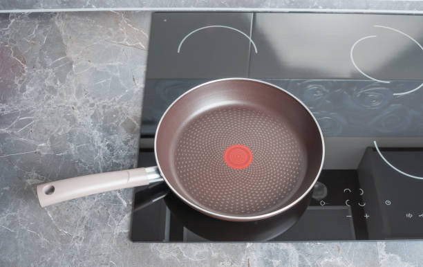 istock Modern electric stove with empty frying pan 1049426196
