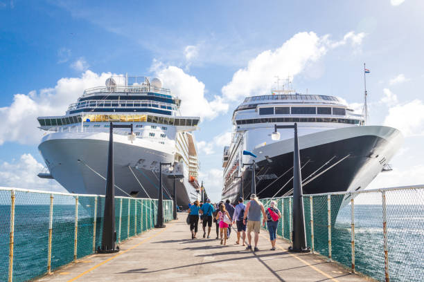 Cruise passengers return to cruise ships stock photo