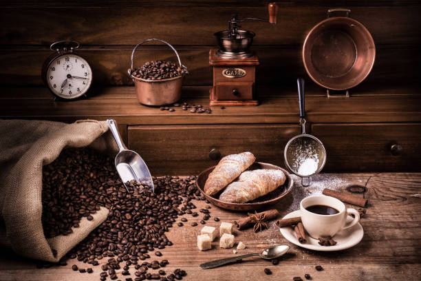 Homemade breakfast with a cup of black coffee sweetened with brown sugar and hot croissants.Still life