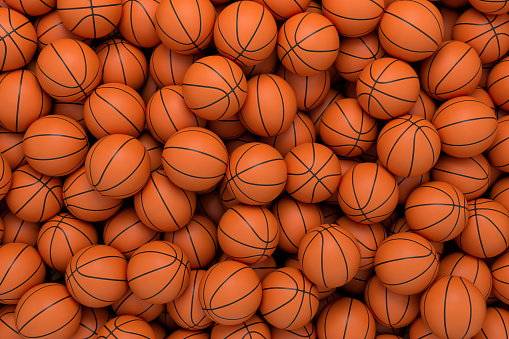 3d rendering of many orange basketball balls lying in an endless pile seen from the top. Sport and free time. Exercise and competition. Team sport.