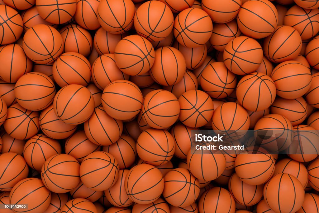 3d rendering of many orange basketball balls lying in an endless pile seen from the top. 3d rendering of many orange basketball balls lying in an endless pile seen from the top. Sport and free time. Exercise and competition. Team sport. Basketball - Sport Stock Photo