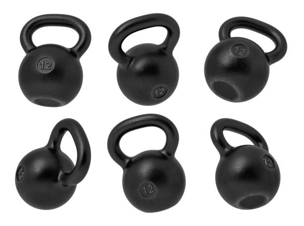istock 3d rendering of 12 kg several black iron kettlebells hanging at different angles on a white background. 1049445334