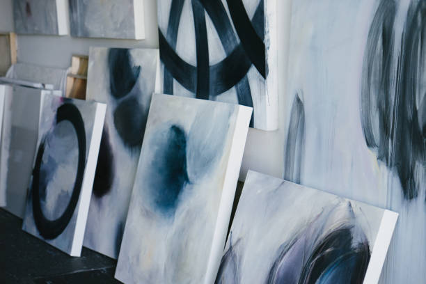 istock Woman painting canvas in art studio 1049451230