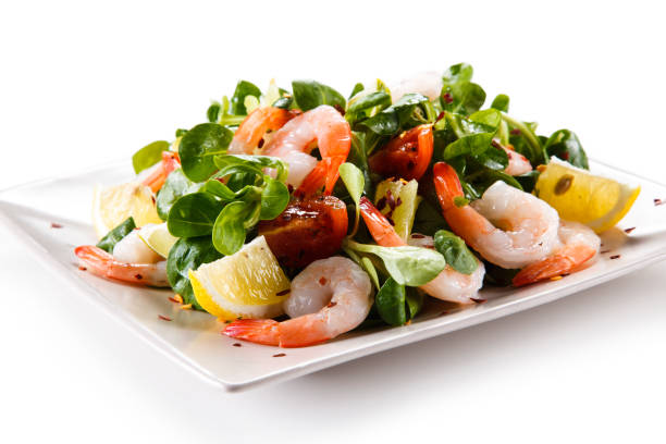 istock Shrimps with vegetables on white background 1049457752