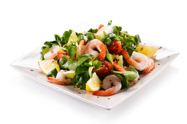 istock Shrimps with vegetables on white background 1049457774