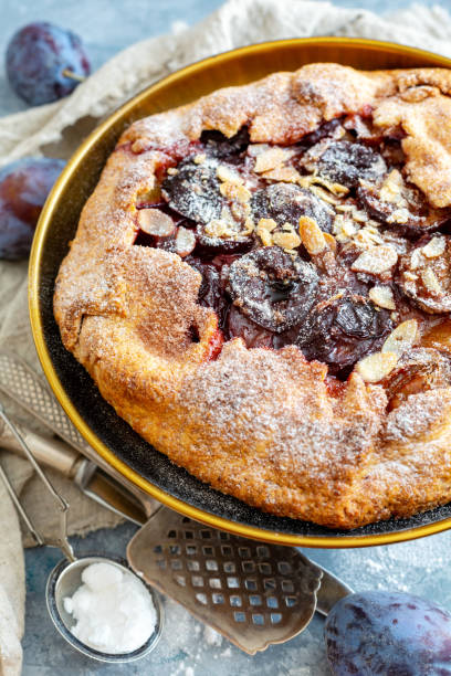 istock Homemade pie with plums,cinnamon and almond flakes. 1049457986