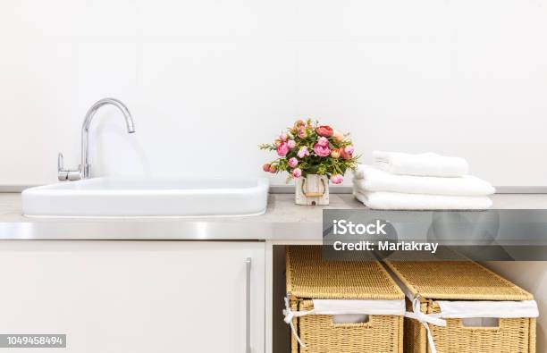 Modern White Laundry Room With Two Baskets Stock Photo - Download Image Now - Laundry, Laundry Basket, Cabinet