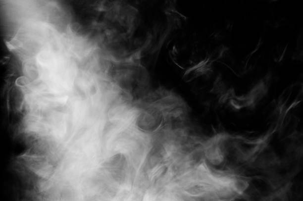 istock smoke in beam of light 1049465144
