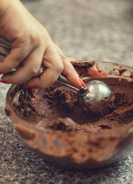 istock Young Woman Preparing Chocolate Truffles 1049465684