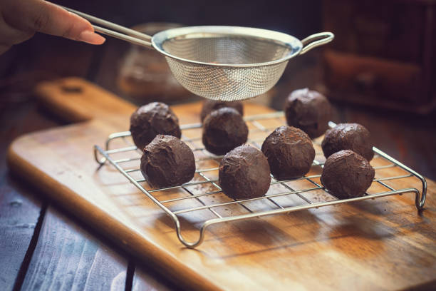 istock Young Woman Preparing Chocolate Truffles 1049465844