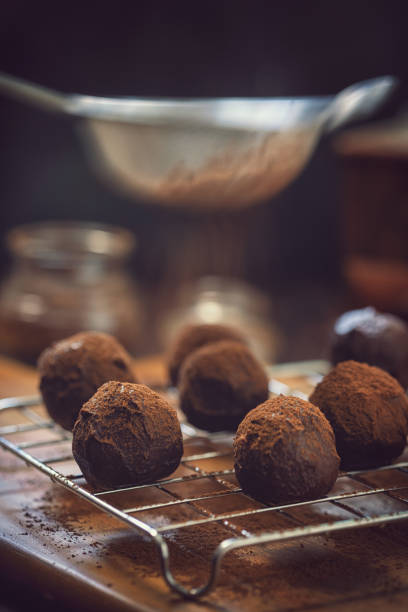 istock Young Woman Preparing Chocolate Truffles 1049465964