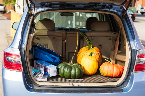 SUV trunk filled with melons for Thanksgiving JONESBOROUGH, TN, USA-9/29/18: An SUV trunk is open, showing a variety of melons. thanksgiving holiday travel stock pictures, royalty-free photos & images