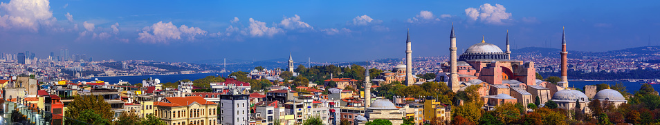 Panoramic view of Istanbul city with historical Hagia Sophia basilica minarets, Bosporus and modern skyline, Turkey