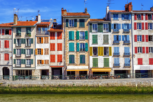 Traditional facades with coloful windows in Bayonne, Basque Country, France