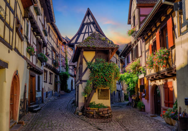 colorful half-timbered houses in eguisheim, alsace, france - haut rhin imagens e fotografias de stock