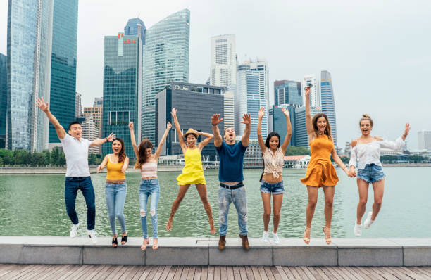 istock Happy friends are jumping 1049473084