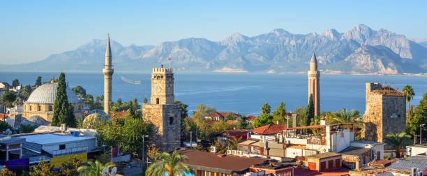 панорамный вид на старый город анталии, турция - old sky sea town стоковые фото и изображения