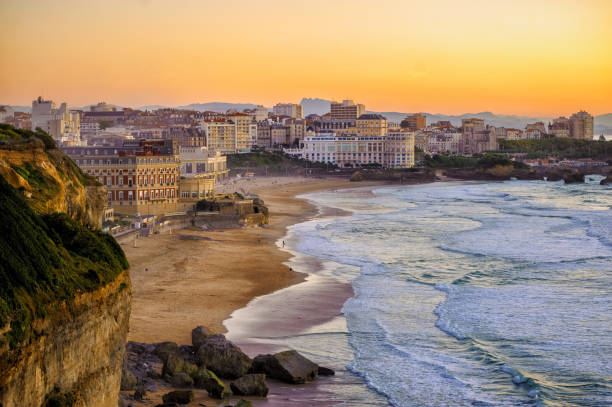 Sunset over Biarritz beaches, France, Atlantic coast Biarritz city and its famous sand beaches - Miramar and La Grande Plage, Bay of Biscay, Atlantic coast, France french basque country photos stock pictures, royalty-free photos & images