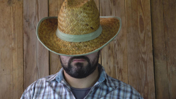 istock A man in a straw hat sleeps 1049480502