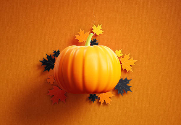 Pumpkin And Maple Leaves On Orange Colored Fabric Background