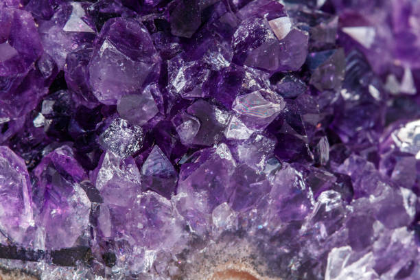 istock Amethyst Crystal Druse  macro mineral on white background 1049484908