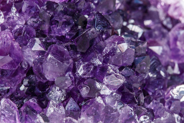 istock Amethyst Crystal Druse  macro mineral on white background 1049485140