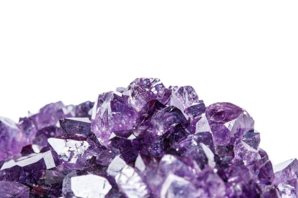 istock Amethyst Crystal Druse  macro mineral on white background 1049485260