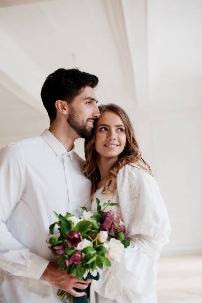 istock Bride And Bridegroom Looking Away 1049485262