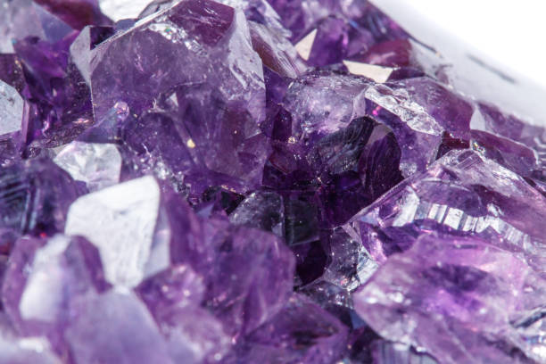 istock Amethyst Crystal Druse  macro mineral on white background 1049485592