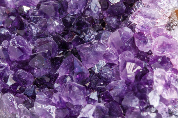 istock Amethyst Crystal Druse  macro mineral on white background 1049485840
